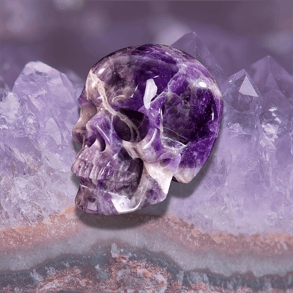 purple crystal skull on office desk for confidence and focus