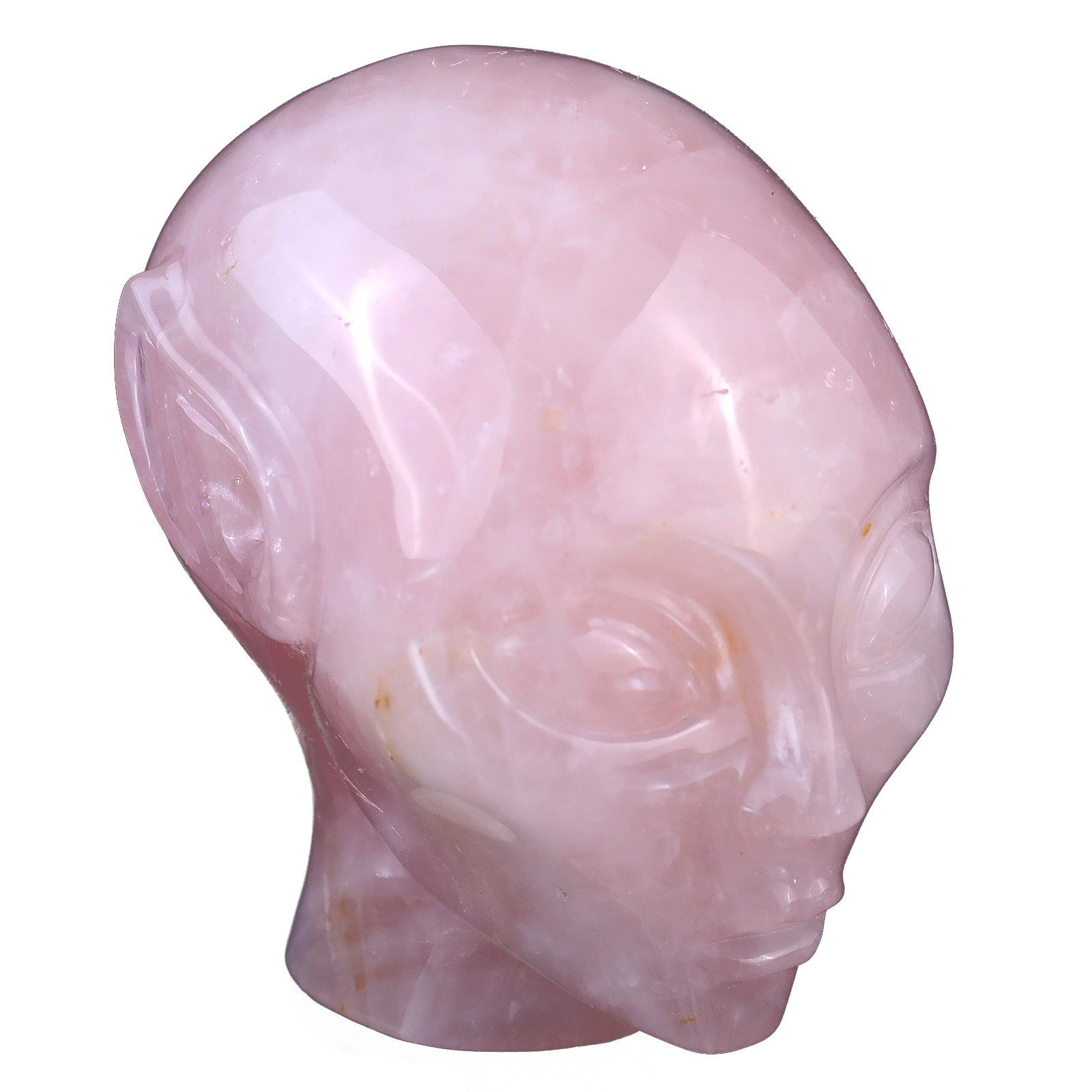 Front view of hand carved natural rose quartz alien crystal skull
