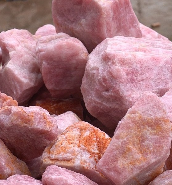 Waiting for the carved Rose Quartz raw stone
